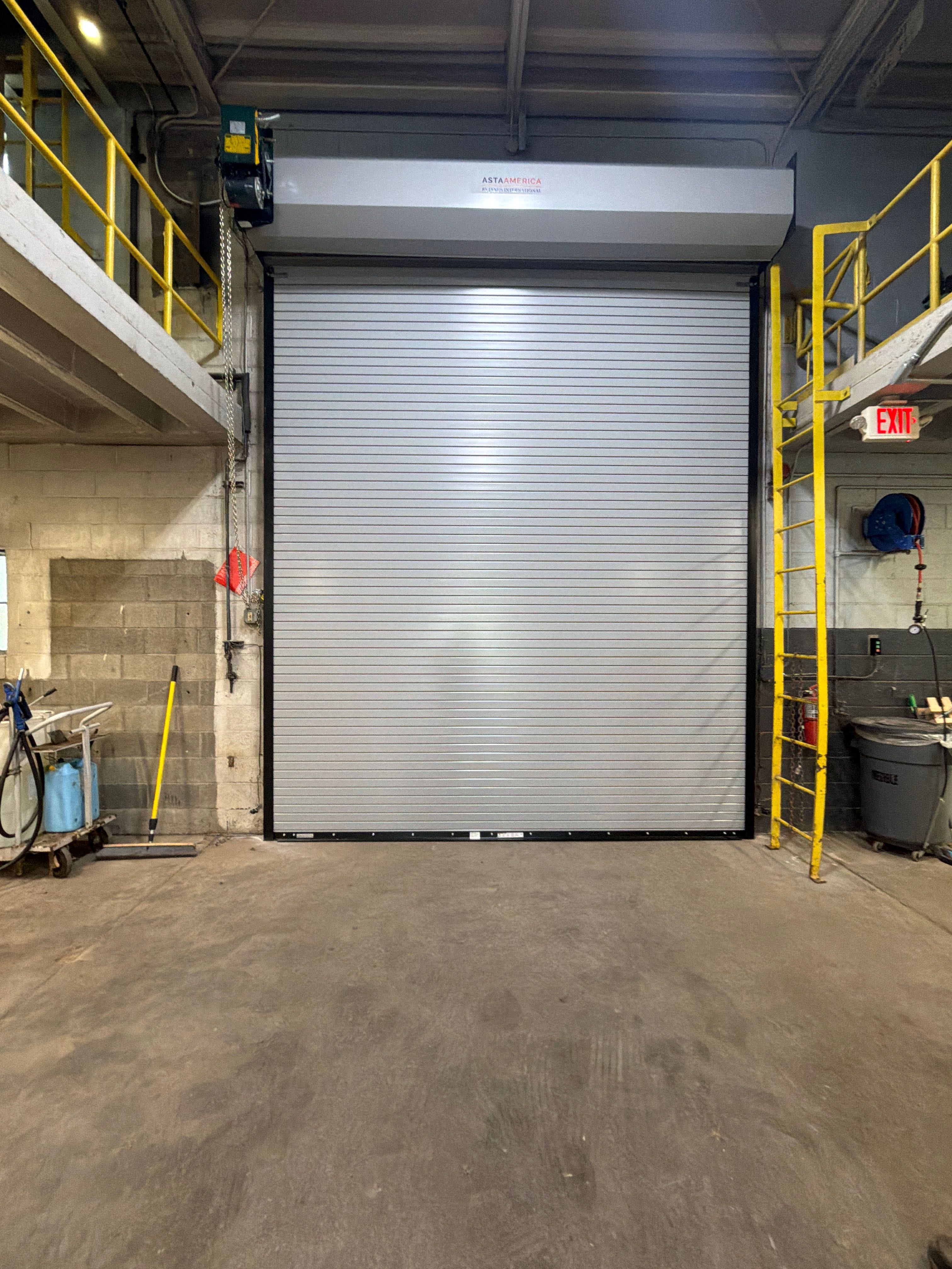 Commercial roll-up door installed in a warehouse bay