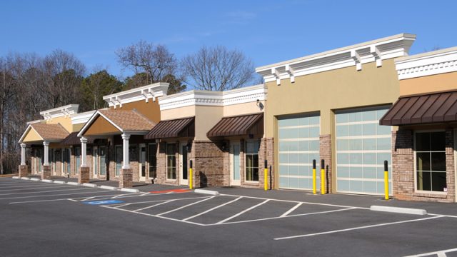 2 closed commercial garage doors at strip store