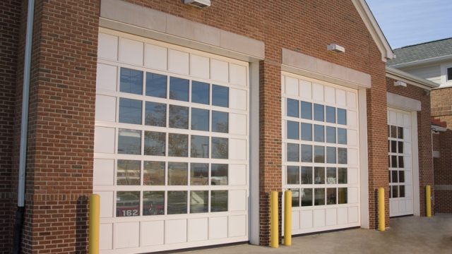 2 closed commercial garage doors with glass paneling